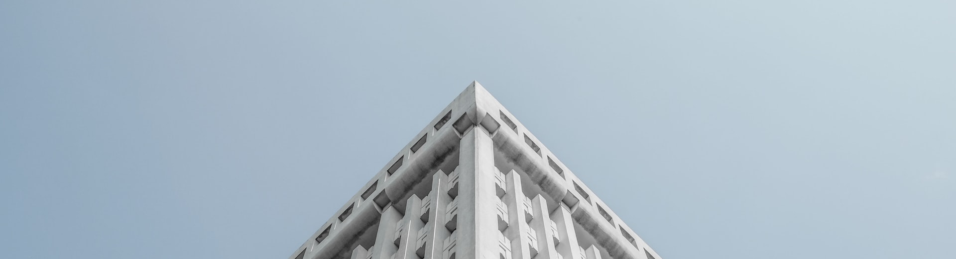 Minimalist building corner against a blue sky